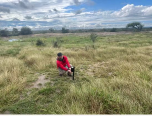 Installing NASA camera traps at a Kruger waterhole.